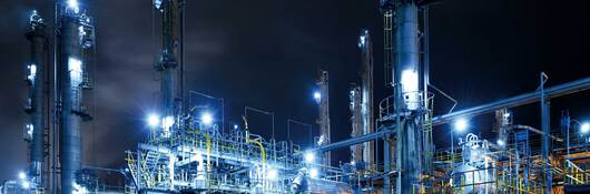 Illuminated oil refinery at night