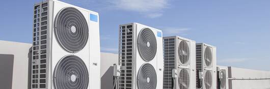 Air conditioning (HVAC) installed on the roof of industrial buildings.