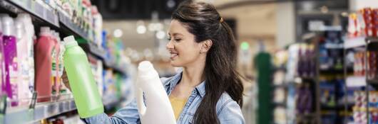 Female shopper looking at products in aisle