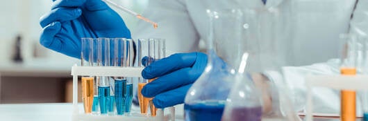 Close up of test tubes being used in chemical lab