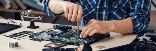 Engineer working on motherboard