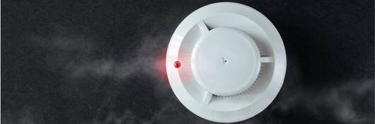 smoke alarm on a black background