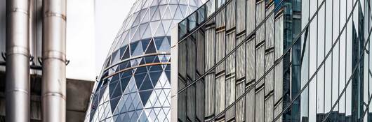 Modern office buildings at the centre of the City of London, including Lloyds of London and the Sir Norman Foster Building.