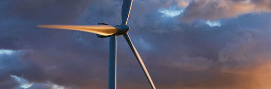 Closeup of a wind turbine at dusk