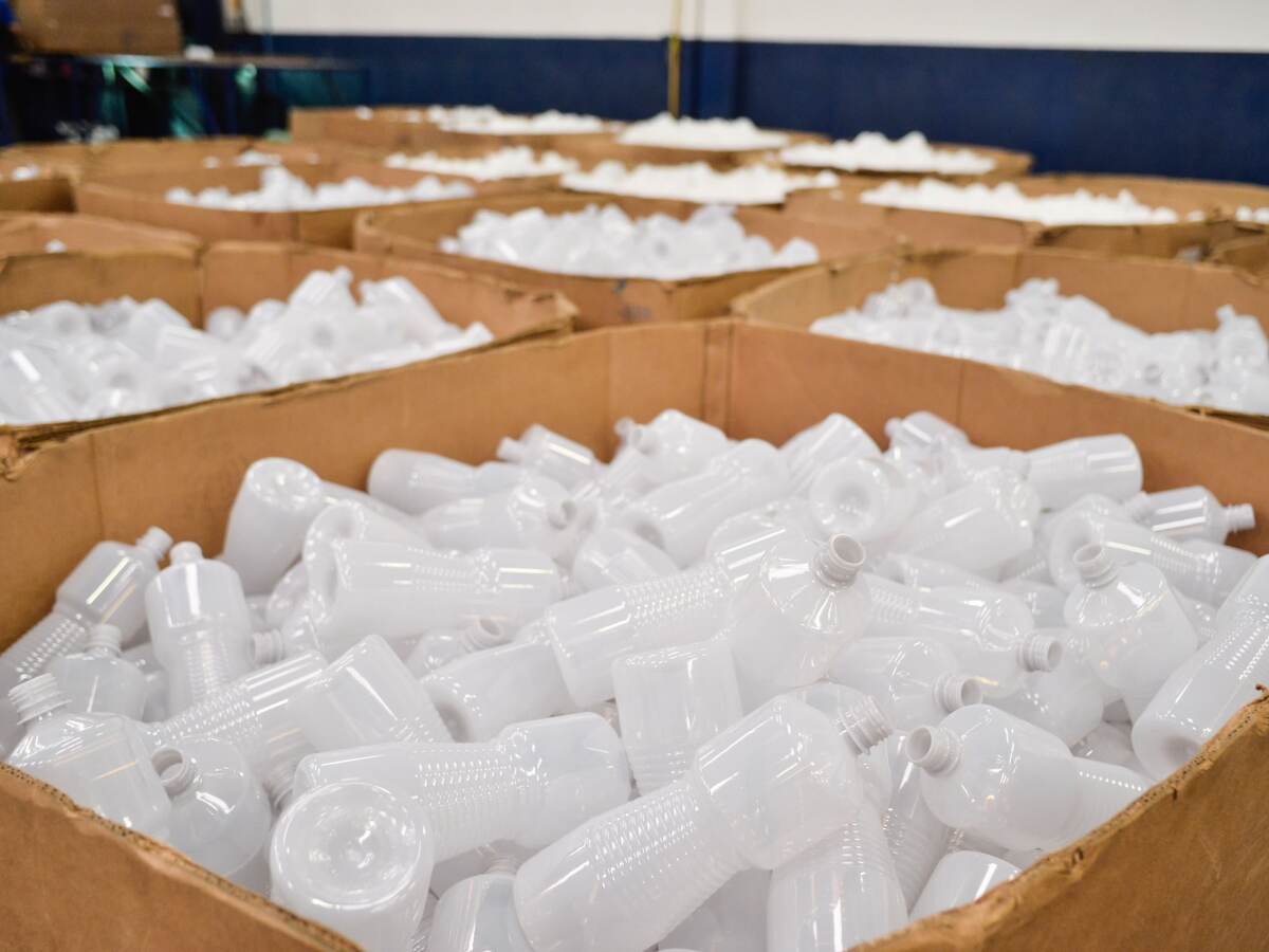 Plastic bottles in boxes.