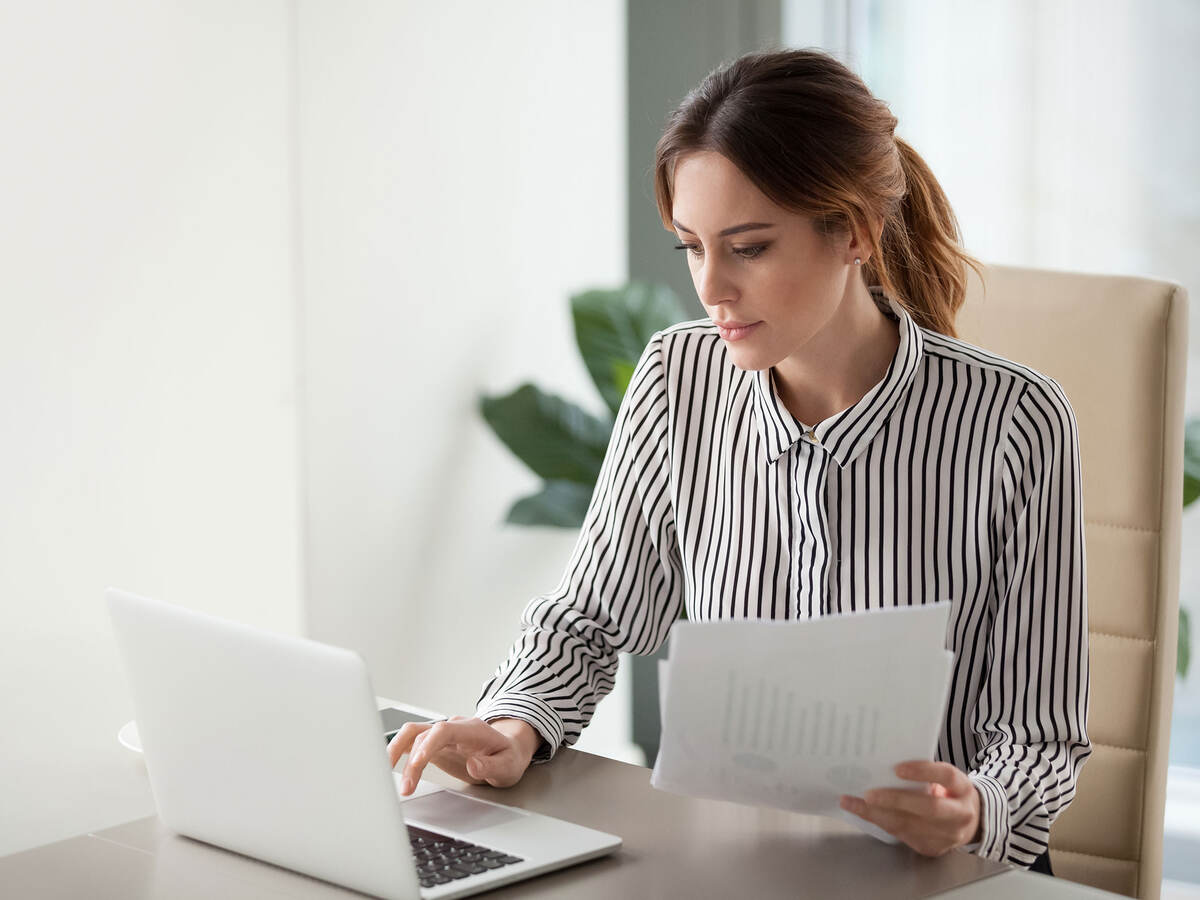 Serious businessperson working on a laptop