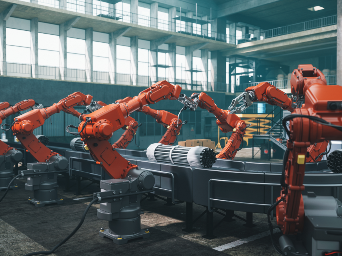 Many robotic arms working on a production line