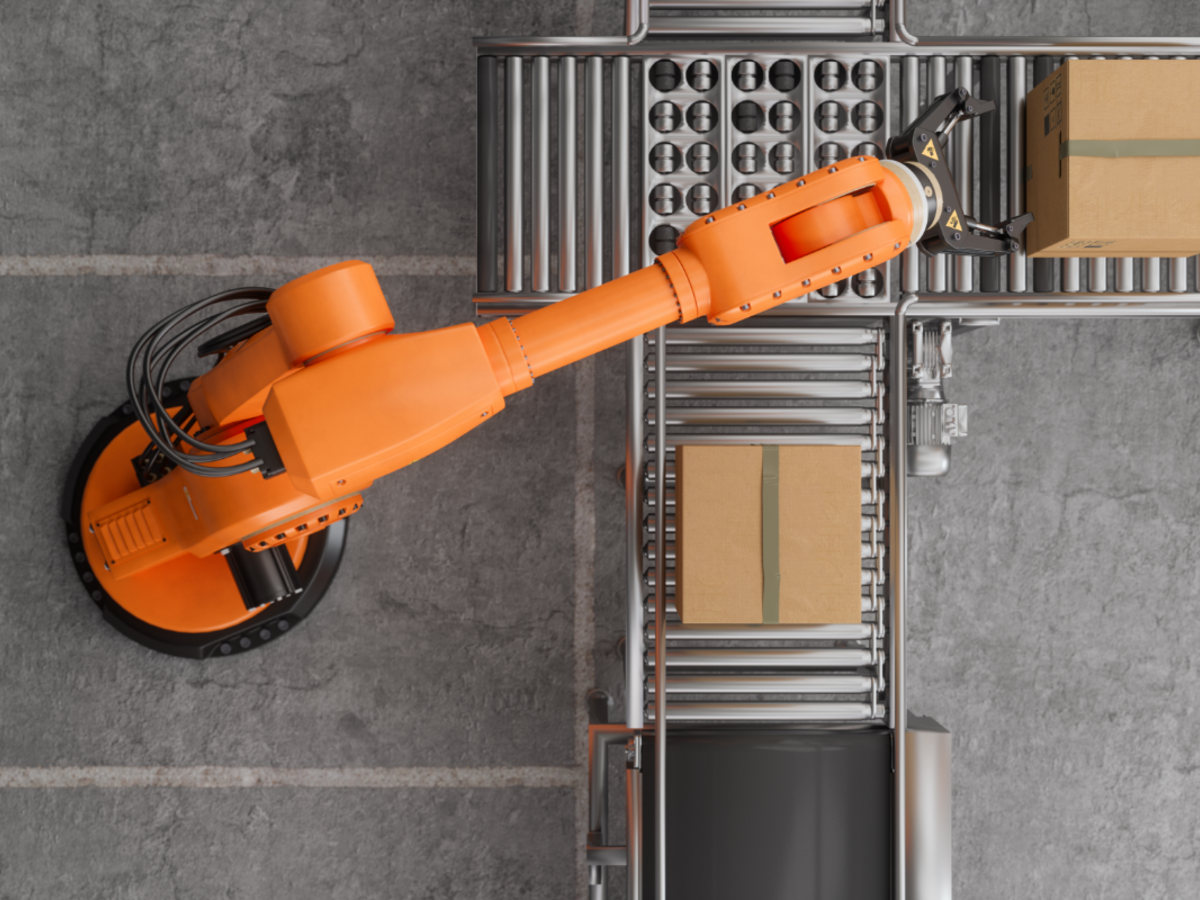 A robotic arm picking up a box