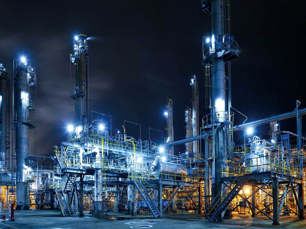 Illuminated oil refinery at night