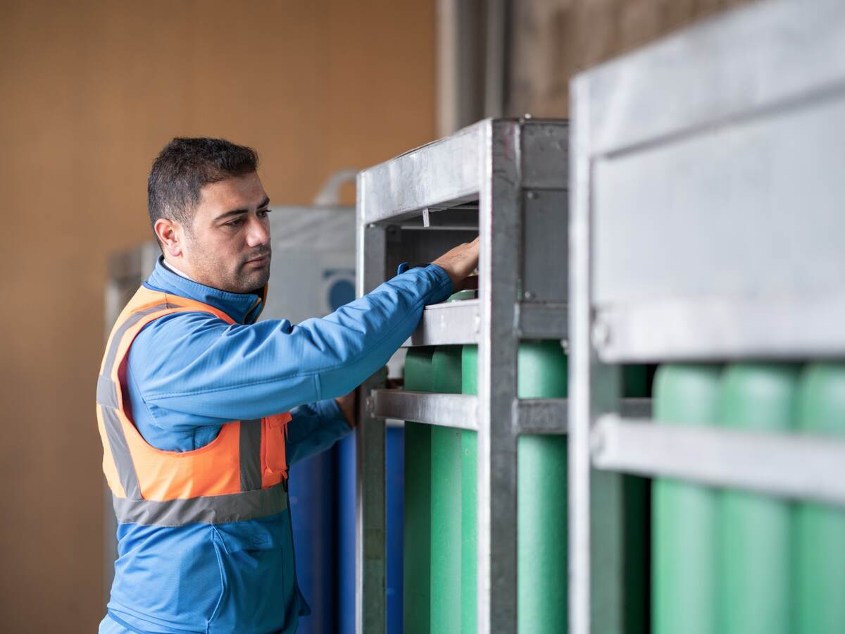 Engineer checking gas cylinders