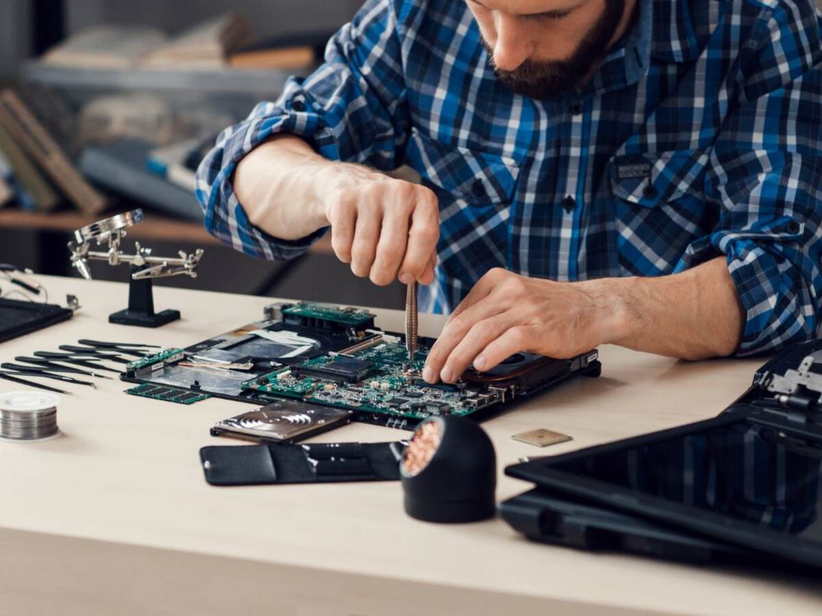 Engineer working on motherboard