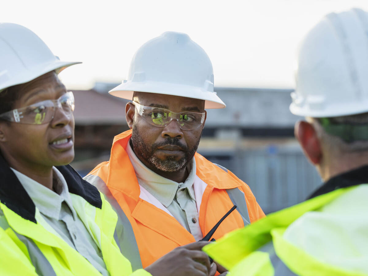 Three people discussing fire barrier management