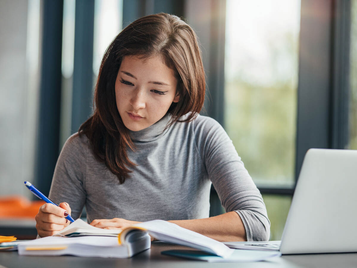 A person taking notes