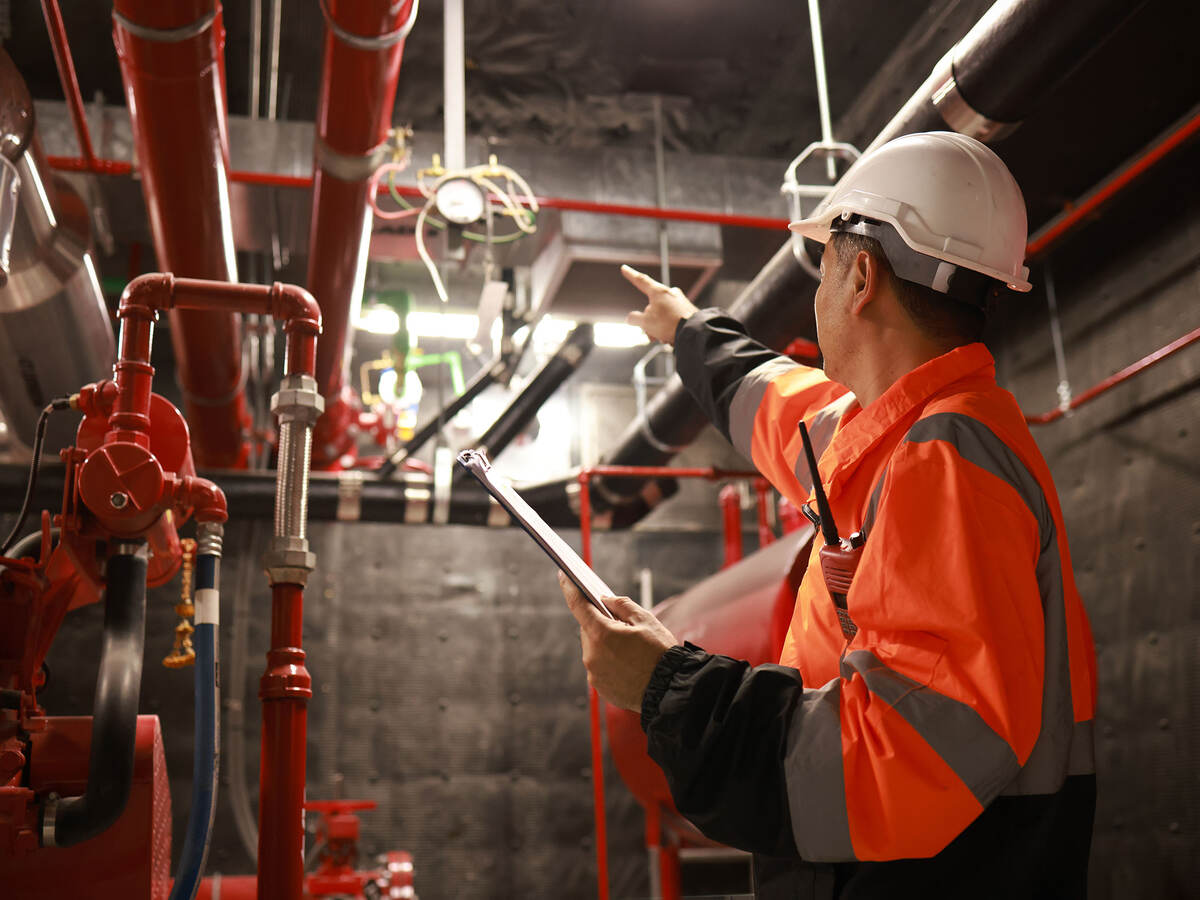 An engineer inspecting safety equipment