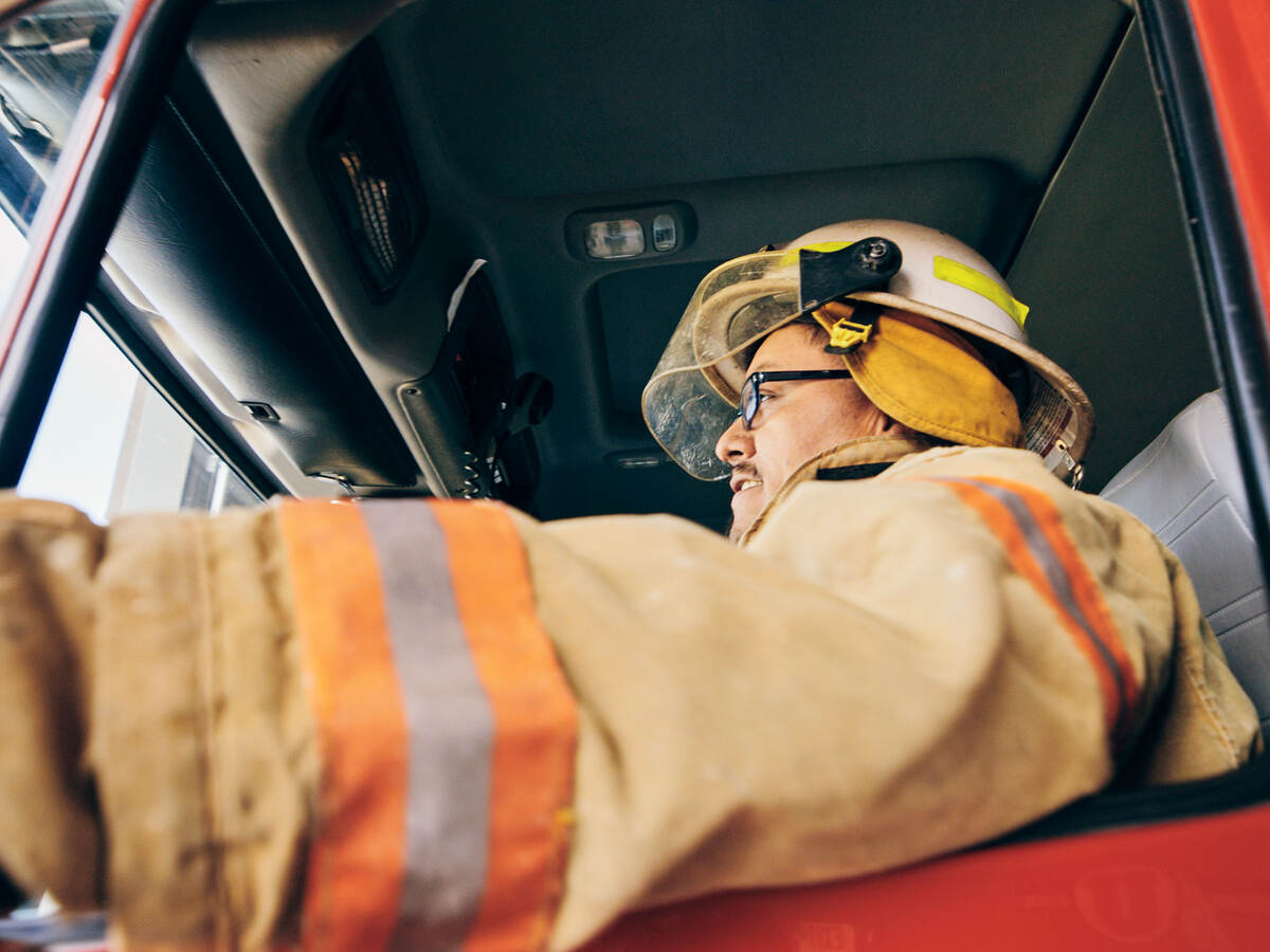 A firefighter in a fire truck