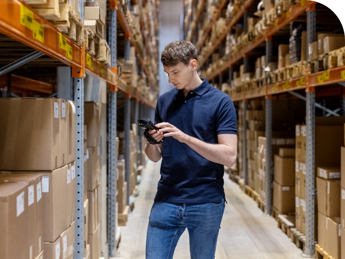 man with scanner in warehouse