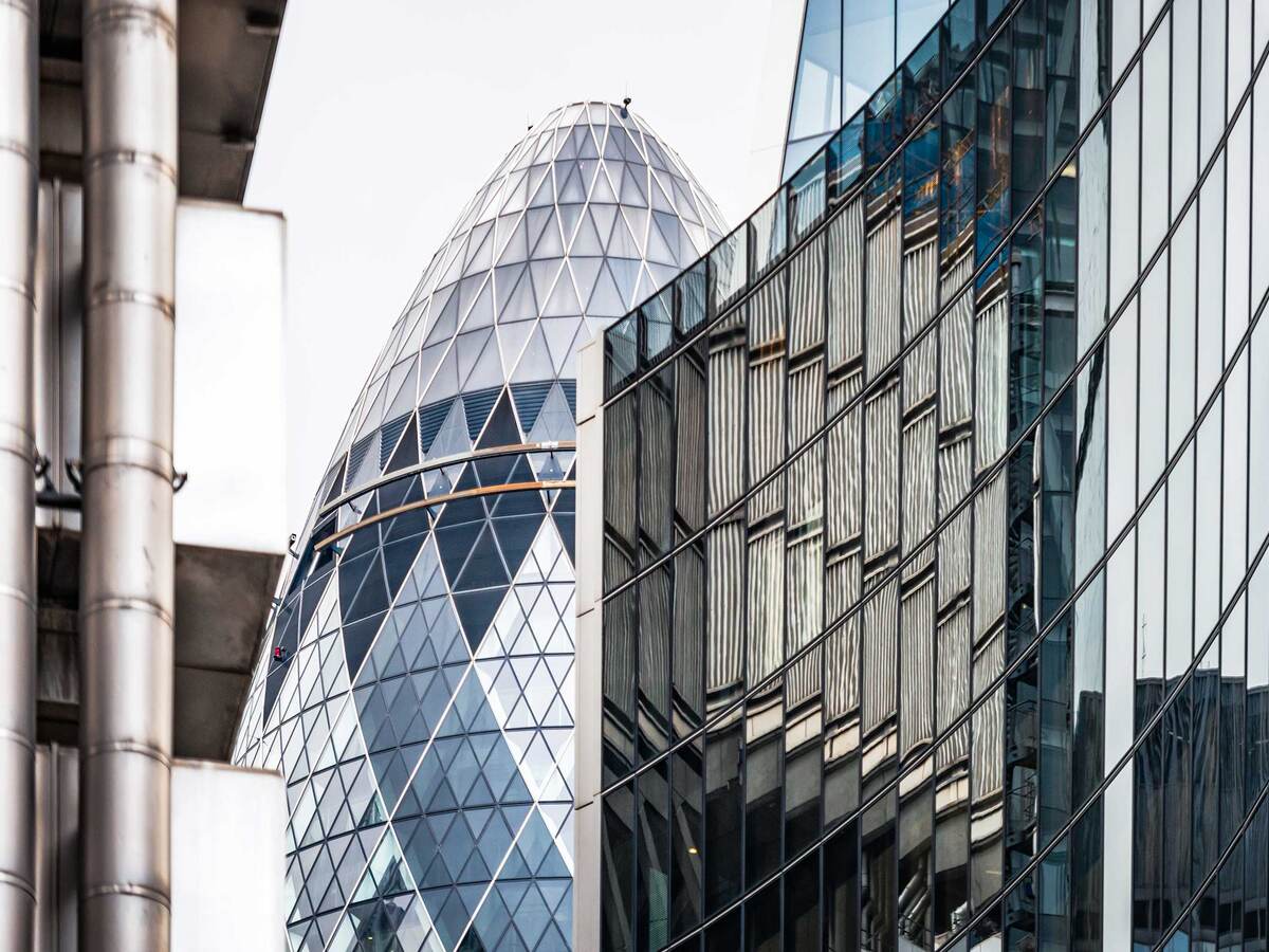 Modern office buildings at the centre of the City of London, including Lloyds of London and the Sir Norman Foster Building.