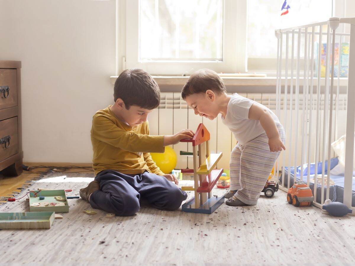 Siblings playing with toys