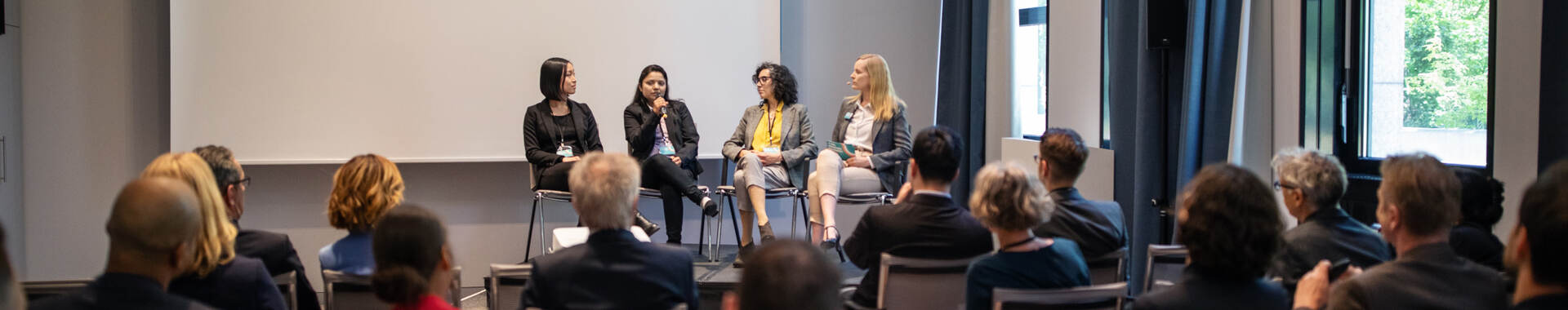 Panel event in a large room full of people