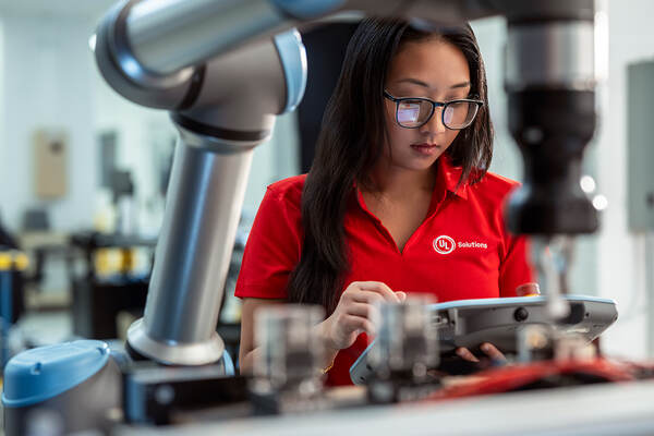 UL Solutions employee in red polo